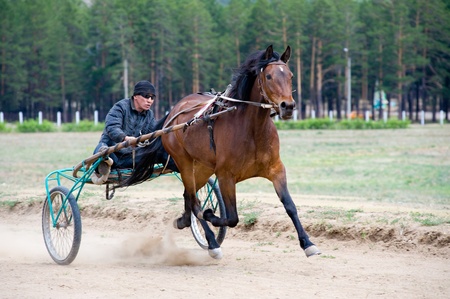 ULAN-UDE, RUSSIA - JUNE 6: An unidentified jockey takes part in the Race for Burytia's President Cup on June 6, 2009 in Ulan-Ude, Buryatia, Russia.のeditorial素材
