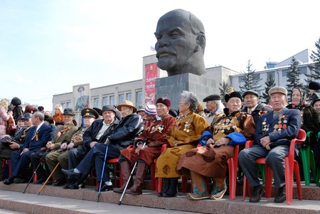 ULAN-UDE, RUSSIA - MAY 9: Elderly veterans of WWII sit at tribunes and watch the parade on annual Victory Day, May, 9, 2008 in Ulan-Ude, Russia.のeditorial素材
