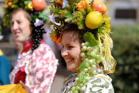 ULAN-UDE, RUSSIA - SEPTEMBER 6: Unidentified women wearing fruit garlands take part in the City parade on annual City Day, September 6, 2008 in Ulan-Ude, Buryatia, Russia.のeditorial素材