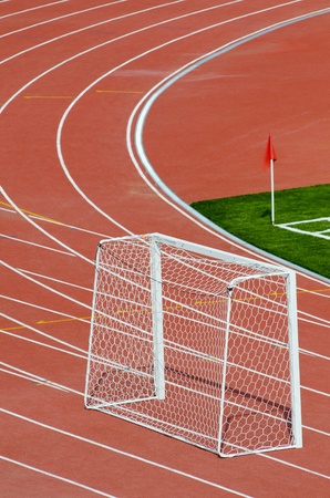 an empty football (soccer) goal at an outdoor stadiumの写真素材