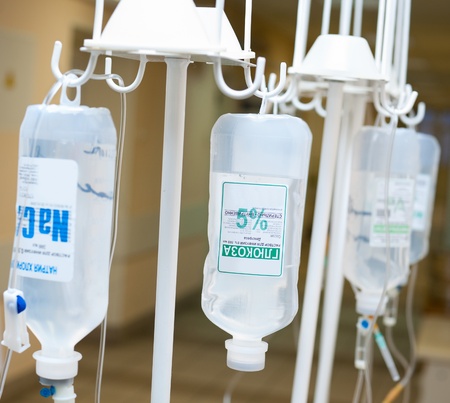 dropping bottles hang on hooks, closeup shotのeditorial素材