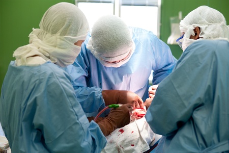 a real surgical operation - three surgeons work