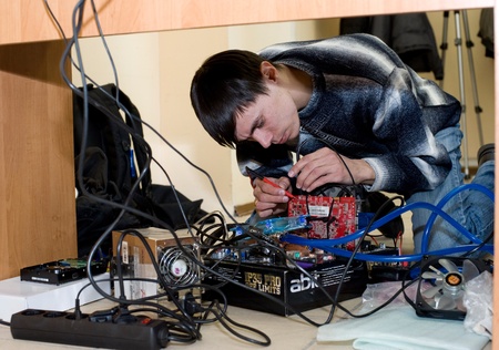 ULAN-UDE, RUSSIA - MARCH 28: The 1st Open City Overclocking Contest. A participant measures the...
