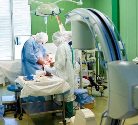 a real surgical operation on forearm bones - a surgeon sutures a wound のeditorial素材
