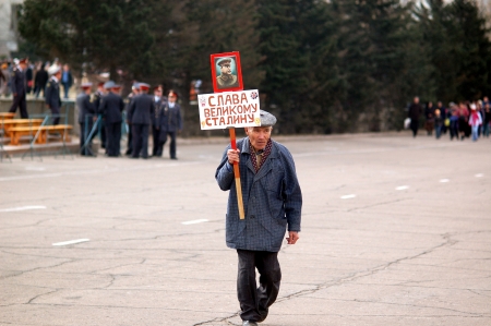 ULAN-UDE, RUSSIA - MAY 9  An unidentified old man carries a Stalins portrait with a slogan below ...