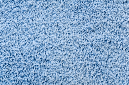 a blue shaggy artificial carpet, closeup shotの写真素材