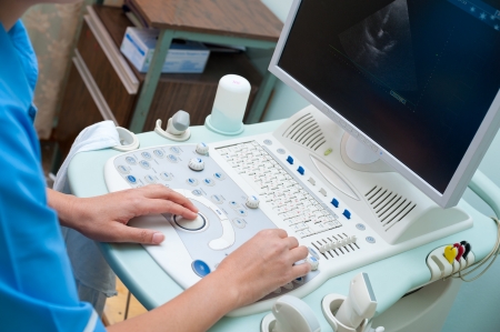 a doctor, an echography specialist, at workの写真素材