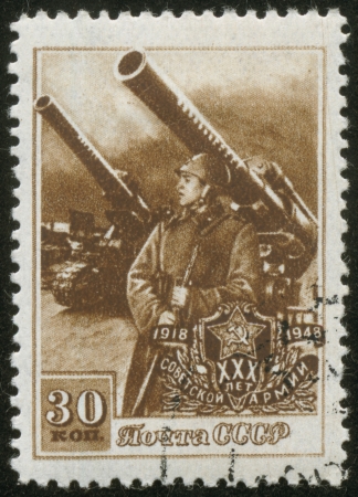 SOVIET UNION - CIRCA 1948  A stamp printed by the Soviet Union Post is entitled  30 years to the Soviet Army   It shows a artilleryman by antiaircraft guns, circa 1948のeditorial素材