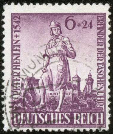 GERMANY - CIRCA 1942  A stamp printed by the fascist Germany Post is entitled  Peter Henlein  1542 Inventor of watch , circa 1942のeditorial素材