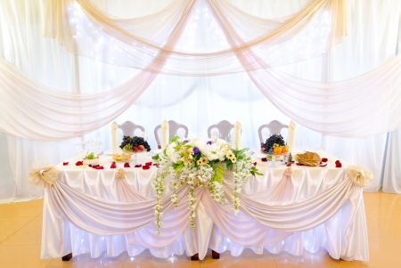 a laid wedding banquet table at a restaurantの写真素材
