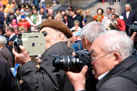 ULAN-UDE, RUSSIA - MAY 9  Unidentified senior reporters - a cinematographer and a photographer shoot...