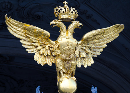 ST  PETERSBURG - JUNE 30, 2011  One of three golden double headed eagles at forged gate at Southern facade of the Winter Palace  From 1732 to 1917 it was the official residence of Russian monarchs のeditorial素材