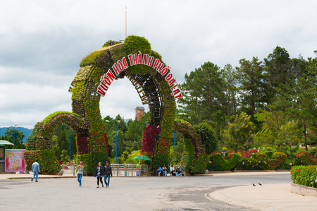 DALAT, VIETNAM - JULY 17, 2014: The main entrance of the Flower Park, one of major tourist attrations in the city. The arch consists of lots of flowers in pots settled on a metal frame.のeditorial素材
