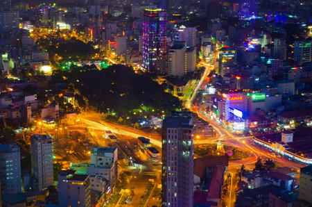 HO CHI MINH, VIETNAM - JULY 11, 2014: A view at the downtown - the park in Pham Ngu Lao Street and the Ben Thanh market from the Bitexco Financial Tower.のeditorial素材