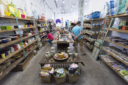 HO CHI MINH, VIETNAM - JAN 15, 2015: Unidentified Caucasian people watch goods at a souvenir shop in the downtown.のeditorial素材