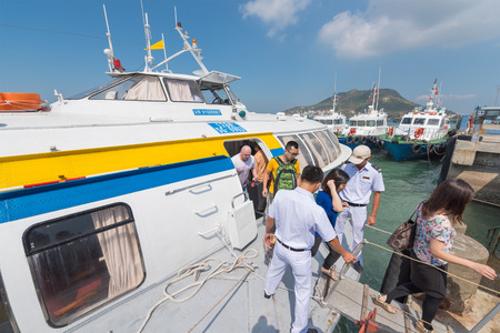 VUNGTAU, VIETNAM - JANUARY 15, 2015: A hydrofoil of the Vina Express transportation company moored at the Vungtau ferry station takes passengers off the board.のeditorial素材