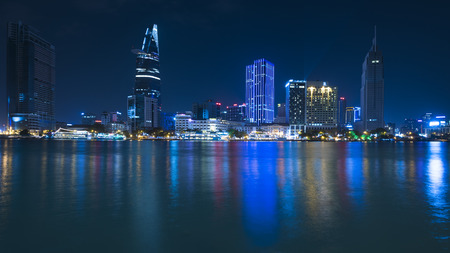 HO CHI MINH, VIETNAM - FEB 07, 2015: A view of night downtown across the Saigon river. Vietnam...