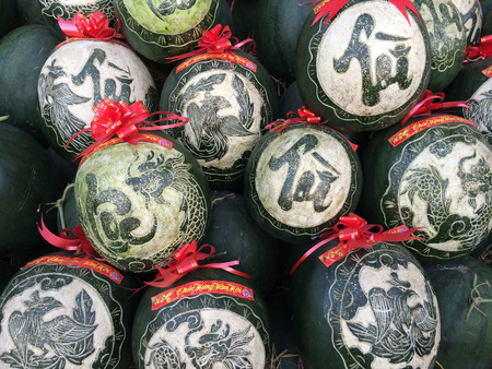 HO CHI MINH, VIETNAM - FEB 15, 2015: Water melons with festive engraving on Tet Eve. Tet is Lunar New Year and celebrated during four days in Vietnam.のeditorial素材