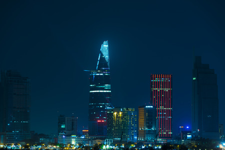 HO CHI MINH, VIETNAM - FEB 07, 2015: A view of night downtown across the Saigon river. Vietnam...