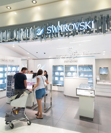 BANGKOK - MARCH 18; 2015: Unidentified people shop at a Swarovski duty free boutique at the International Airport Suvarnabhumi which is the sixth busiest airport in Asia.のeditorial素材
