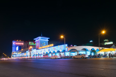 HO CHI MINH, VIETNAM - MARCH 25, 2015: The Ben Thanh Market facade with night illumination. While tourists search here souvenirs townspeople come to buy fresh food.のeditorial素材