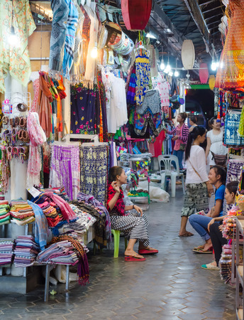 SIEM REAP, CAMBODIA - JUNE 21, 2014: Unidentified tourists shop at the night market of Siem Reap. The city serves as a gateway to the world famous Angkor temples and is a major tourist hub.のeditorial素材