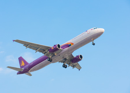 HO CHI MINH, VIETNAM - FEB 9, 2015: An unidentified plane of the Cambodia Angkor Air approaches the...