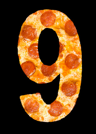 number 9 cut out of pizza with peperoni and cheese isolatedの写真素材