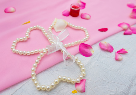 wedding still life - pearl necklace and petalsの写真素材