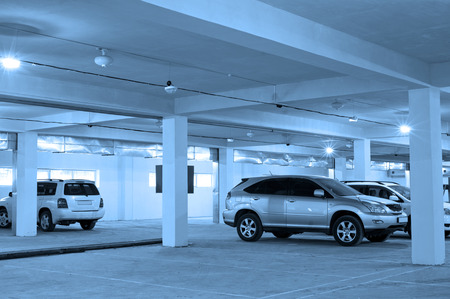 underground parking with some cars in itの写真素材