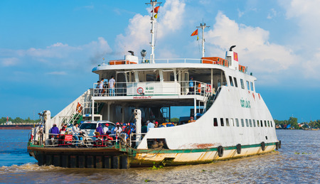 HO CHI MINH, VIETNAM - OCTOBER 2, 2015: A ferry brings commuters and vehicles from Cat Lai New Port to the opposite bank of the Nha Be River. Ho Chi Minh City is the largest city in Vietnam (9 mln).のeditorial素材