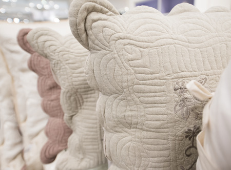 new beige embroidered linen pillows, closeup shotの写真素材