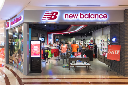 KUALA LUMPUR - JUNE 15, 2016: The New Balance store in Suria KLCC. New Balance was founded in 1906 as "New Balance Arch Support Company" and is one of the worlds major sports footwear manufacturers.のeditorial素材