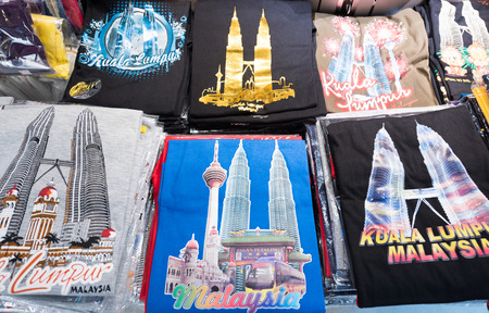 KUALA LUMPUR - JUNE 15, 2016: Souvenir gift tshirts with pictures in the Chinatown market, commonly known as Petaling Street. There are lots of budget hotels and cheap food in this neighborhood.のeditorial素材