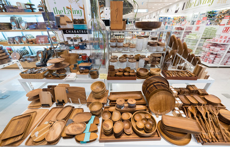 BANGKOK - MARCH 17, 2016 : Various wooden dishes and other utensils at a store of home goods in the Siam Paragon Mall. It is one of the biggest shopping centers in Asia.のeditorial素材