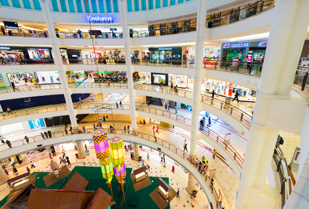 KUALA LUMPUR - JUNE 15, 2016: Unidentified people walk on 6 floors of the Suria KLCC shopping mall. The mall is located in the Kuala Lumpur City Centre district near the famous Petronas Towers.のeditorial素材