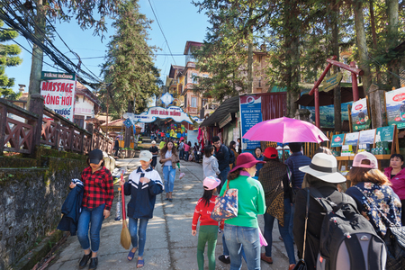 SA PA, VIETNAM - NOVEMBER 5, 2016: Tourists walk in the local street market. Sapa is a popular tourist destination in northern Vietnam.のeditorial素材