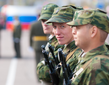 ULAN-UDE, RUSSIA - MAY 9, 2009: A young russian soldier standing in a line at the parade on an annual Victory Day looks into camera. Russia has compulsory military service limited to 1 year.のeditorial素材