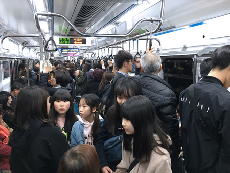 SEOUL - MARCH 25, 2017: A lot of people stand in a Korail underground carriage. Korea Railroad Corporation (Korail), is the national railroad operator in South Korea.のeditorial素材