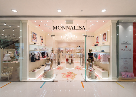 HONG KONG - MARCH 16, 2017: A Monnalisa store of childrens clothing in the Ocean Terminal, Harbour City. Ocean Terminal is a cruise terminal and shopping centre located on Canton Road.のeditorial素材