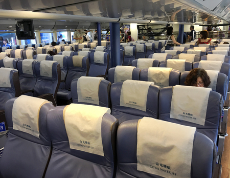 MACAU - SEPT 15, 2017: Passengers leave the board of a Cotai Water Jet ferry from Hong Kong. Cotai Water Jet is a company that operates high speed ferry services between Macau and Hong Kongのeditorial素材