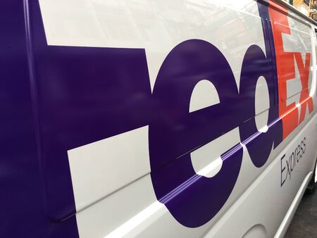 BANGKOK - DECEMBER 2017: A van of FedEx in the city center. FedEx Corporation is an American...
