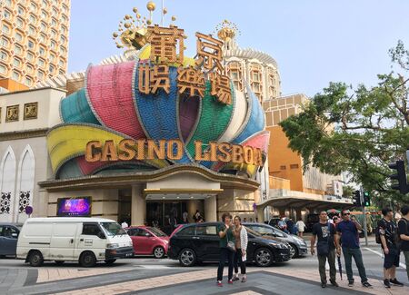 MACAU - SEPTEMBER 2017: People in front of the Casino Lisboa, owned by a Stanley Ho company. Ho has been nicknamed King of Gambling for he held monopoly on the Macau gambling industry for 75 years.のeditorial素材