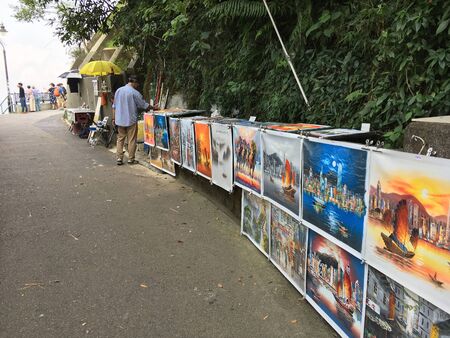 HONG KONG - SEPTEMBER 18, 2017: Paintings for sale at Victoria Peak, a mountain in the western half of Hong Kong Island. It is also known as Mount Austin and locally as The Peak.のeditorial素材