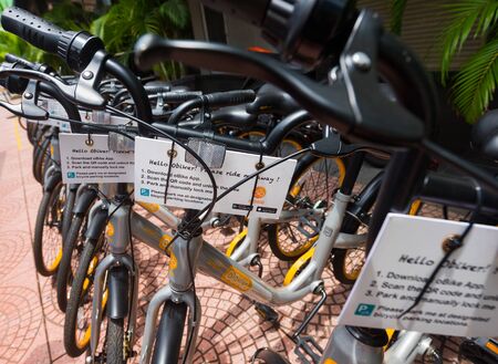 KUALA LUMPUR - SEPT 12, 2017: oBike bicycles at a docking station near China town. oBike is a Singapore based stationless bicycle sharing system with operations in several countriesのeditorial素材