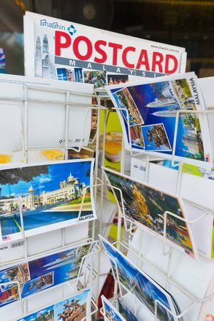 KUALA LUMPUR - SEPTEMBER 12, 2017: Various postcards with Malaysian landmarks on sale by the Central Market, one of the most popular city tourist attractions.のeditorial素材