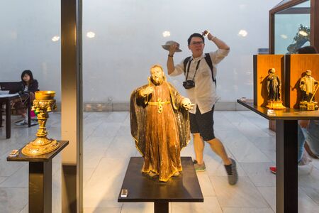 MACAU - SEPTEMBER 16, 2017: People at the Museum of Sacred Art housing various Catholic art works dating from the 16th to 20th centuries including some items of the St. Paulâs Ruins history.のeditorial素材