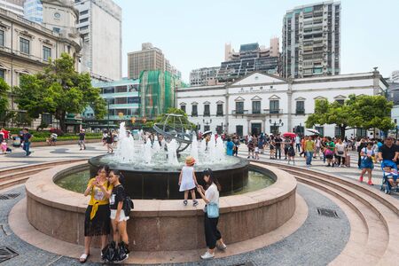 MACAU - SEPTEMBER 16, 2017: People stroll by the Civic and Municipal Affairs Bureau (Portuguese: Instituto para os Assuntos CÃ­vicos e Municipais). Macau is a casino resort city in Southern China.のeditorial素材
