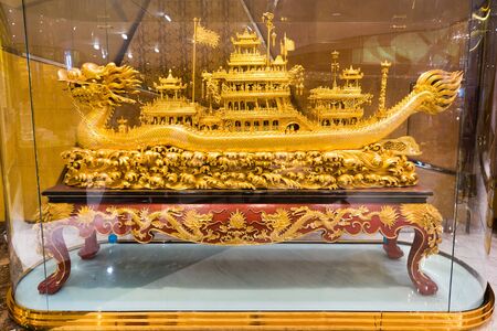 MACAU - SEPTEMBER 16, 2017: A fancy gold dragon ship in the interior of the Grand Lisboa hotel, the tallest building in Macau and the most distinctive part of its skylineのeditorial素材