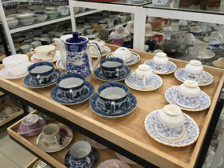 SIEM REAP, CAMBODIA - APRIL 27, 2020: Lots of tableware and crockery for sale at Sakura recycle shop of second hand goods.のeditorial素材